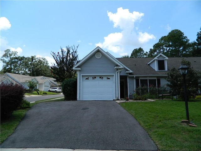 view of front of home with a garage and a front yard