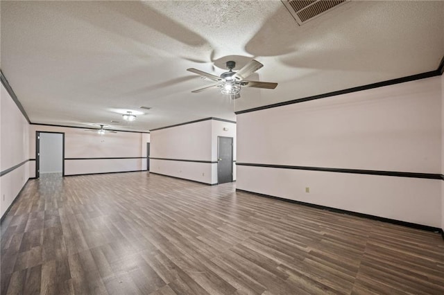 unfurnished room featuring a textured ceiling, ceiling fan, wood-type flooring, and crown molding