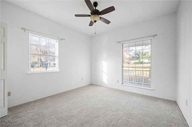 unfurnished room featuring carpet and ceiling fan