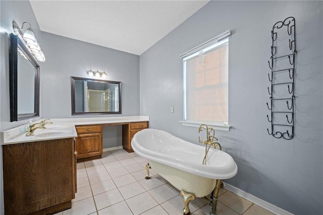 bathroom with tile patterned flooring, vanity, and a bathing tub