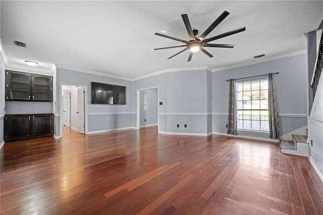 unfurnished living room featuring dark wood-type flooring, ceiling fan, and crown molding