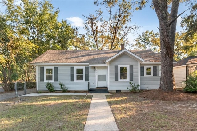 ranch-style house with a front lawn, fence, entry steps, a chimney, and crawl space