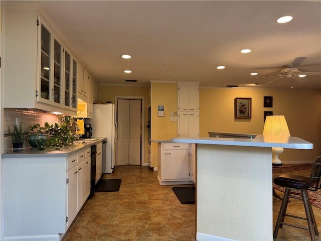 5721 Long Meadow Rd, Mobile, AL 36609 - kitchen with recessed lighting, a kitchen breakfast bar, a ceiling fan, light countertops, and backsplash