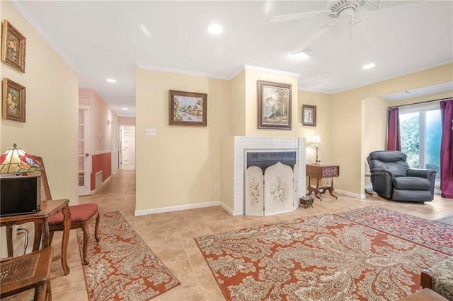 5721 Long Meadow Rd, Mobile, AL 36609 - living area featuring crown molding, a ceiling fan, a tiled fireplace, recessed lighting, and baseboards