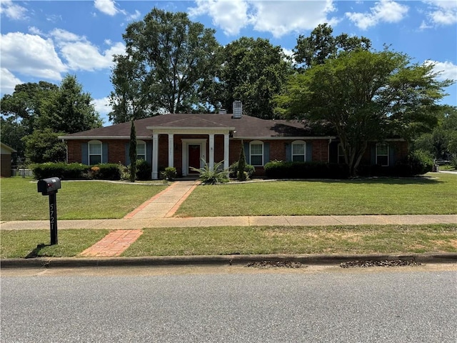 single story home with a front lawn