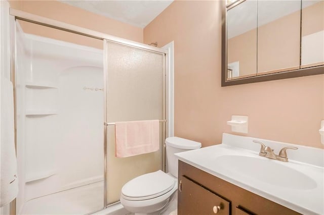 5721 Long Meadow Rd, Mobile, AL 36609 - bathroom featuring a stall shower, vanity, and toilet