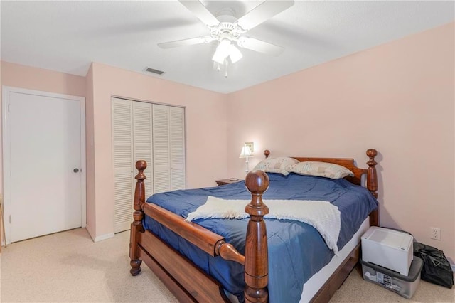 5721 Long Meadow Rd, Mobile, AL 36609 - bedroom featuring light colored carpet, a closet, ceiling fan, and baseboards