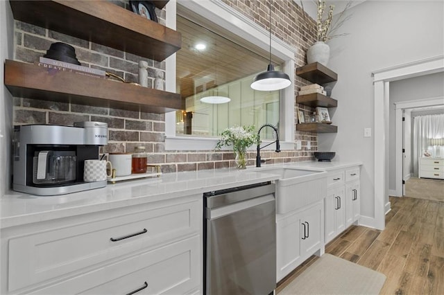 kitchen featuring open shelves, stainless steel appliances, white cabinets, and backsplash