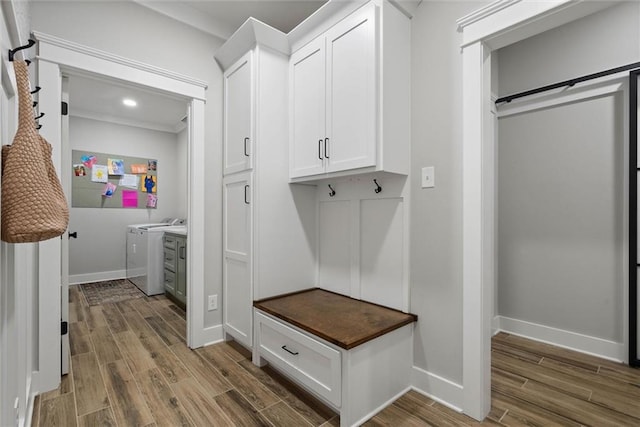 mudroom with separate washer and dryer, wood finished floors, baseboards, and recessed lighting