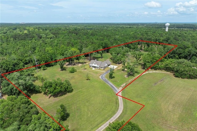 drone / aerial view featuring a view of trees