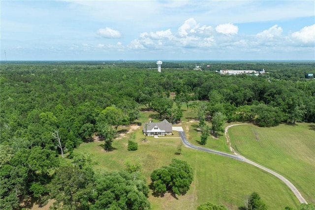 drone / aerial view featuring a forest view