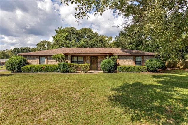 ranch-style house with a front lawn