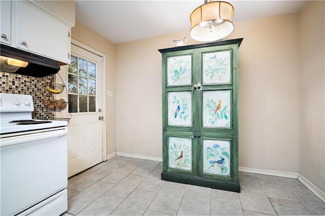 doorway to outside with baseboards and light tile patterned flooring