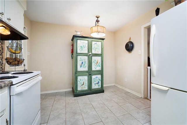 kitchen with light tile patterned floors, extractor fan, white appliances, white cabinets, and dark countertops