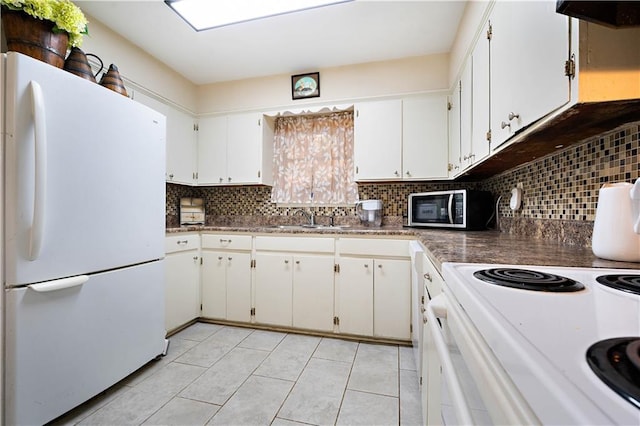 kitchen featuring tasteful backsplash, white appliances, extractor fan, and white cabinets