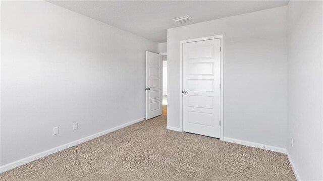 8616 Brooklyn Ct, Semmes, AL 36575 - spare room featuring carpet and baseboards