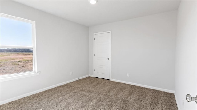 8616 Brooklyn Ct, Semmes, AL 36575 - spare room featuring healthy amount of natural light and carpet
