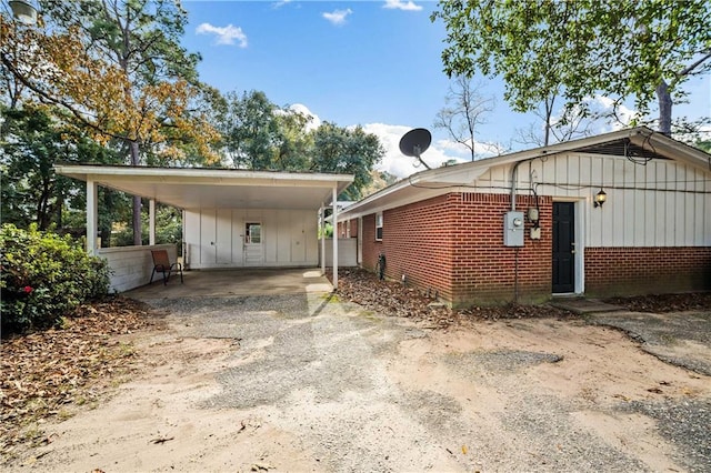 view of side of property with a carport