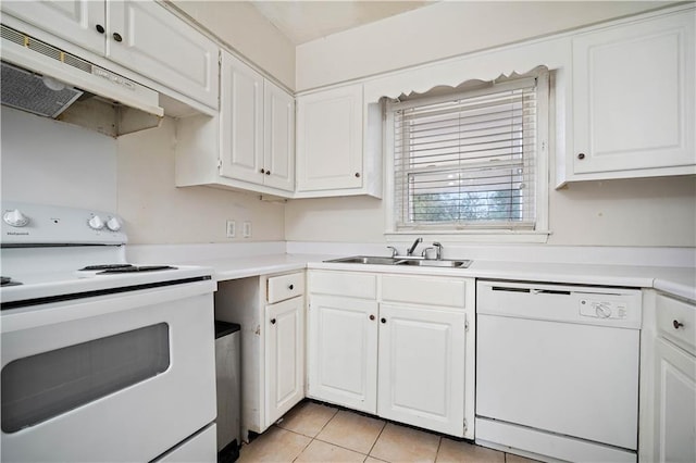 kitchen featuring light tile patterned flooring, white appliances, white cabinetry, and sink