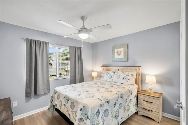 400 Plantation Rd Unit 4206, Gulf Shores, AL 36542 - bedroom with wood finished floors, baseboards, and a ceiling fan