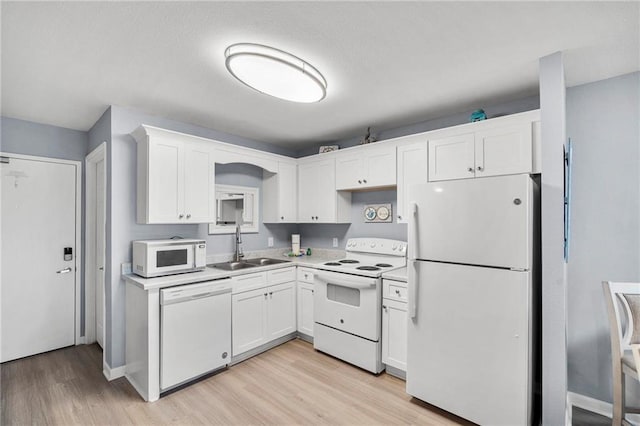 400 Plantation Rd Unit 4206, Gulf Shores, AL 36542 - kitchen featuring white appliances, a sink, white cabinetry, light wood-type flooring, and light countertops
