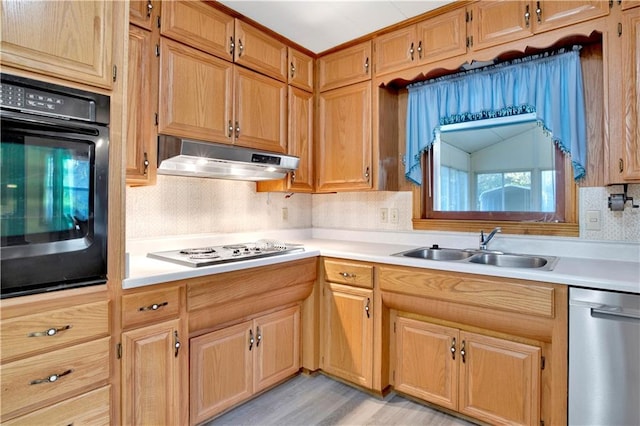 kitchen featuring dishwasher, black oven, decorative backsplash, sink, and white electric cooktop