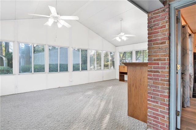 unfurnished sunroom with vaulted ceiling and ceiling fan