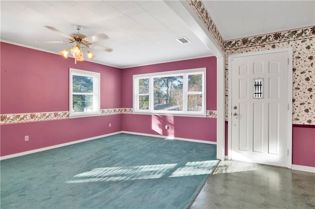 carpeted foyer entrance with ceiling fan