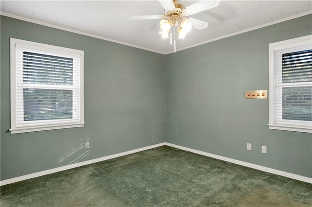 carpeted spare room featuring ceiling fan and crown molding