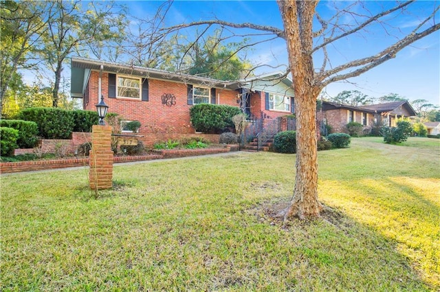 ranch-style home featuring a front yard