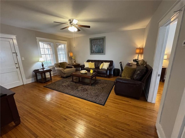 living room with ceiling fan and wood-type flooring