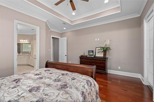 bedroom with ensuite bath, ceiling fan, dark hardwood / wood-style floors, and ornamental molding