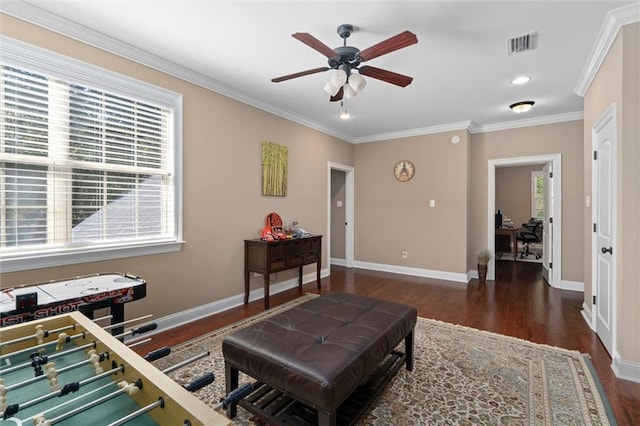 living room featuring ceiling fan, dark wood-type flooring, and ornamental molding