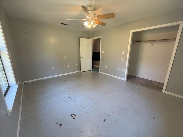 unfurnished bedroom featuring concrete floors, a closet, and ceiling fan