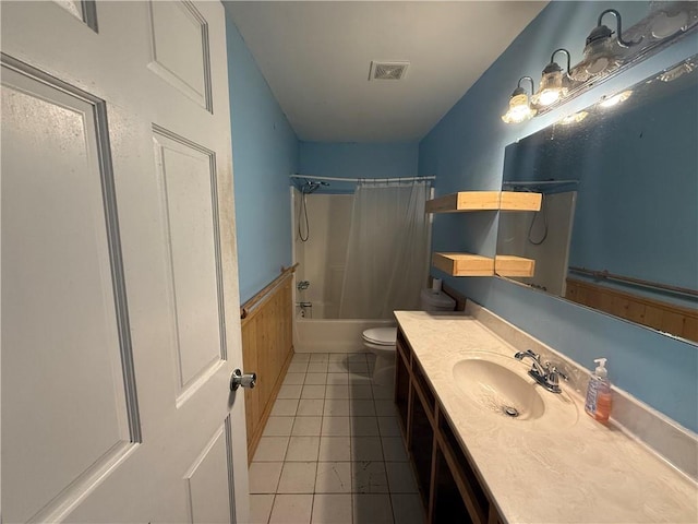 full bathroom with toilet, shower / tub combo with curtain, vanity, and tile patterned flooring