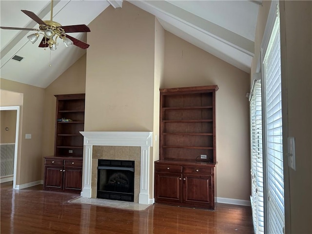5901 Eastridge Pl, Mobile, AL 36608 - unfurnished living room with ceiling fan, a tiled fireplace, dark wood-style flooring, beamed ceiling, and baseboards