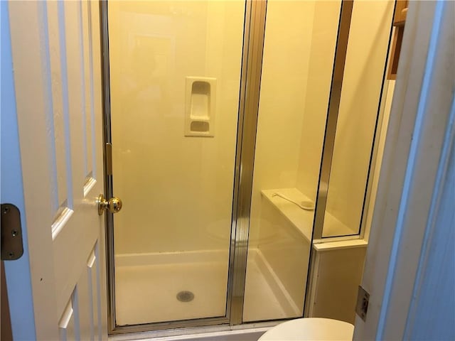 5901 Eastridge Pl, Mobile, AL 36608 - bathroom featuring a stall shower and toilet