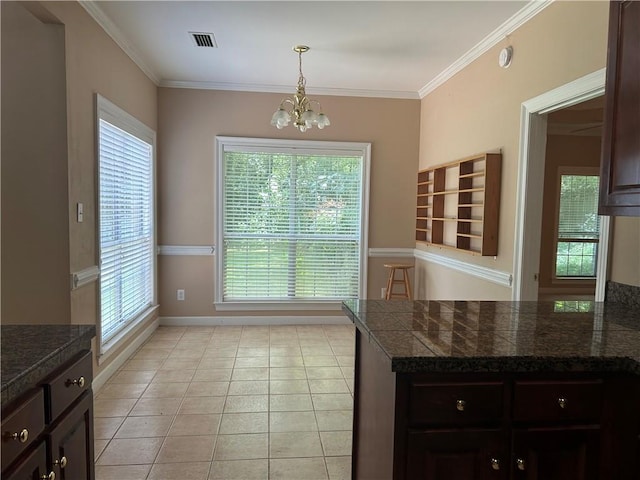5901 Eastridge Pl, Mobile, AL 36608 - unfurnished dining area with a chandelier, healthy amount of natural light, crown molding, light tile patterned flooring, and baseboards