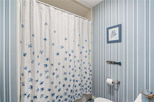 bathroom with a shower with curtain