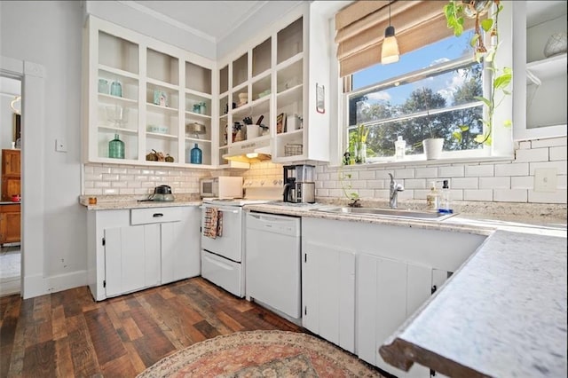 kitchen with white appliances, sink, dark hardwood / wood-style flooring, white cabinetry, and backsplash