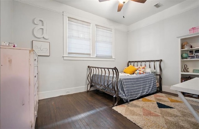 bedroom with dark hardwood / wood-style flooring and ceiling fan