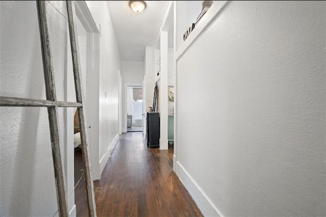 corridor with dark wood-type flooring