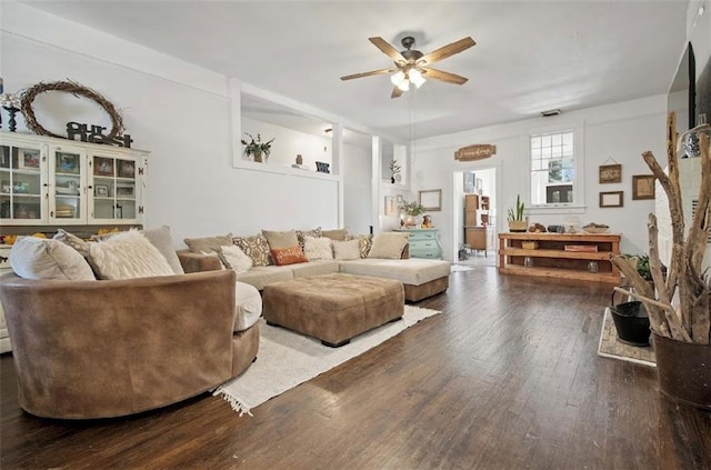 living room with ceiling fan and wood-type flooring