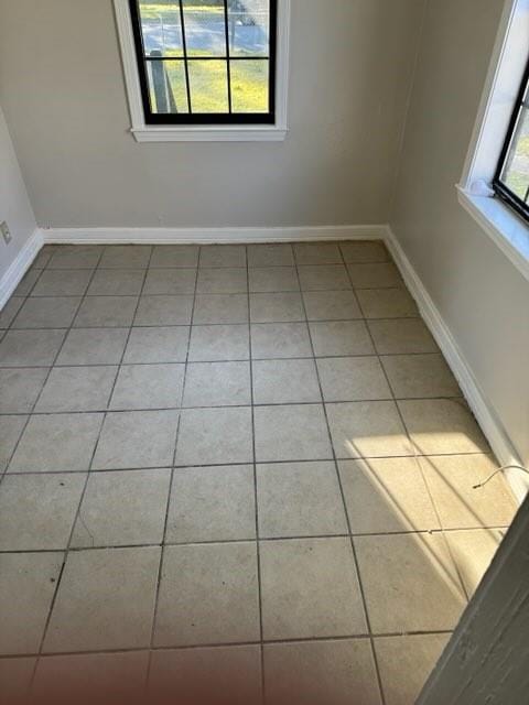 empty room featuring light tile patterned floors