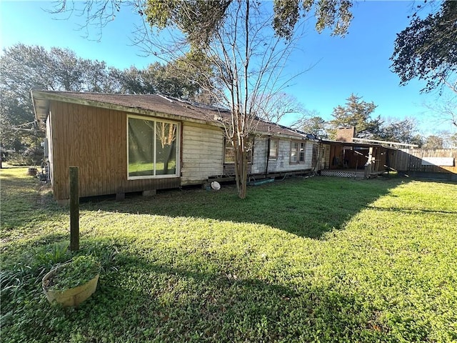 rear view of house with a yard