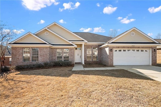 view of front of house with a garage and a front lawn