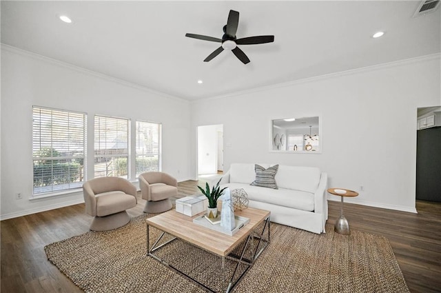 living room with crown molding, dark wood-type flooring, and ceiling fan