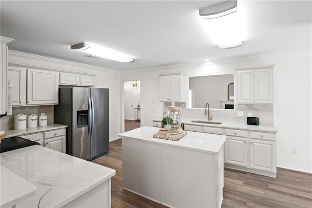 kitchen featuring sink, white cabinets, and stainless steel fridge with ice dispenser