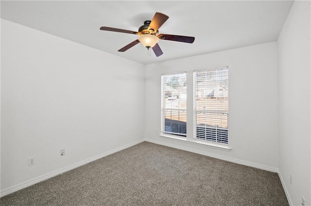 spare room with ceiling fan and carpet floors