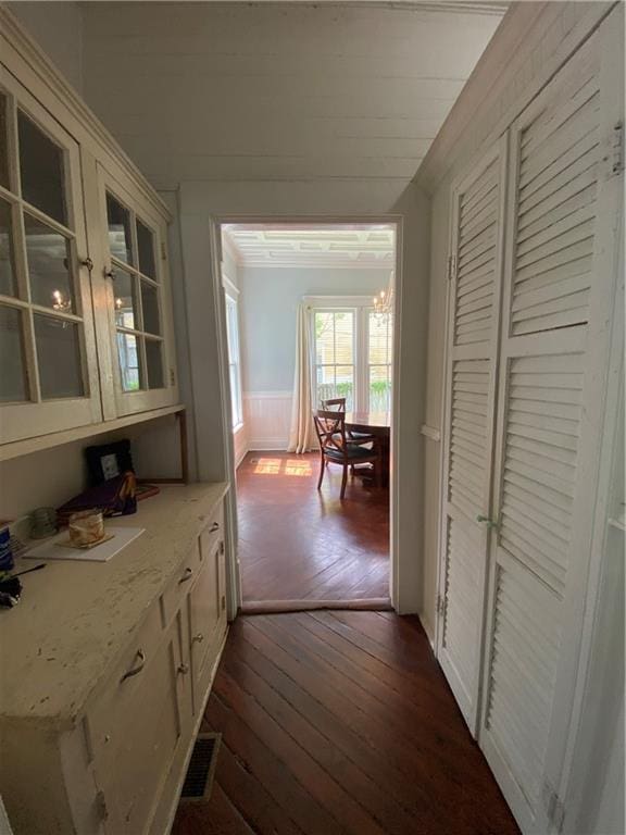 112 Kilmarnock St, Mobile, AL 36604 - corridor featuring a wainscoted wall and dark wood-style floors